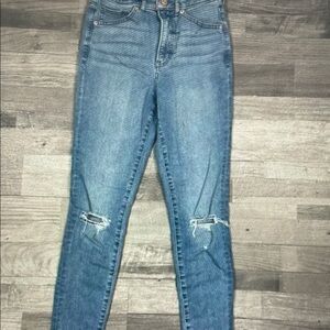 Express Women's Light Blue Skinny Jeans with Knee Rips